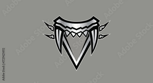 Intricate silver fang design with sharp teeth and pointed edges on gray background.