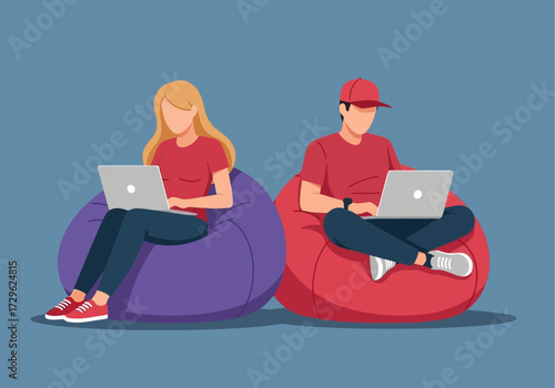 Man and woman sitting on bean bags using laptops