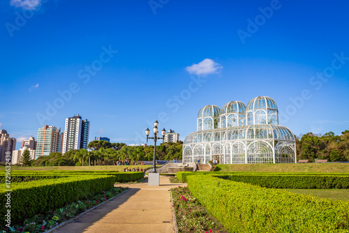Botanical Garden of Curitiba on a sunny day with blue sky and lush tropical vegetation
