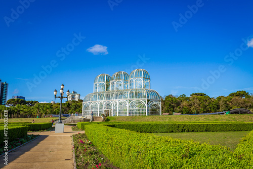 Botanical Garden of Curitiba on a sunny day with blue sky and lush tropical vegetation