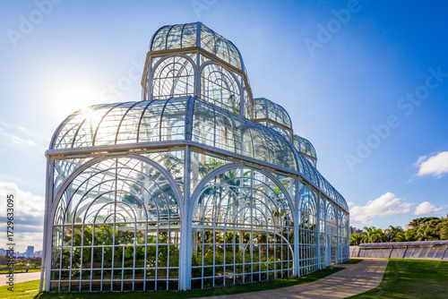 Botanical Garden of Curitiba on a sunny day with blue sky and lush tropical vegetation