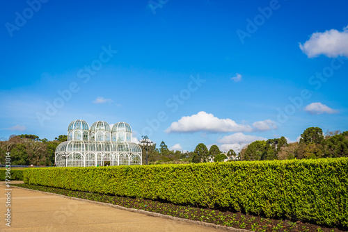 Botanical Garden of Curitiba on a sunny day with blue sky and lush tropical vegetation