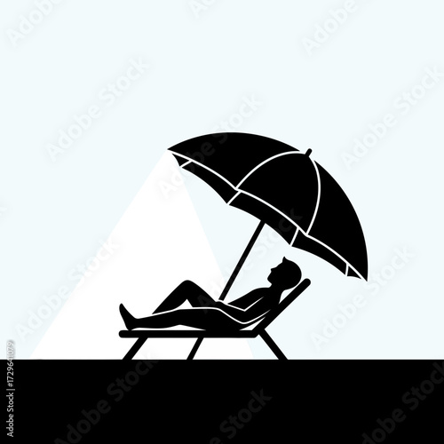 Silhouette of person relaxing on beach chair under umbrella