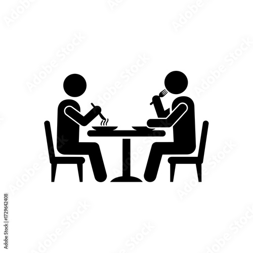 Two people eating at a table