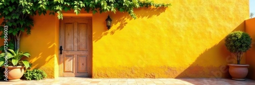 Sun-drenched yellow stucco wall, climbing vines, colonial Mexican architecture, building, decor