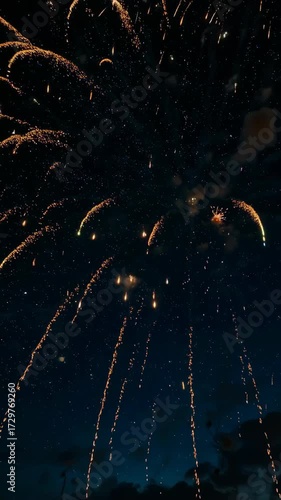 Aerial Drone View Flying Through Fireworks Display. This dynamic point-of-view shot offers a unique and breathtaking perspective on a New Year's Eve celebration.