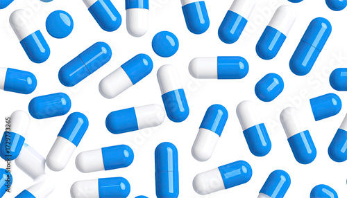 Scattered blue and white medicine capsules