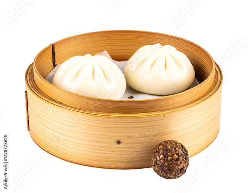Two steamed buns in a bamboo steamer basket, a dark-colored ball is slightly off-center to the bottom right