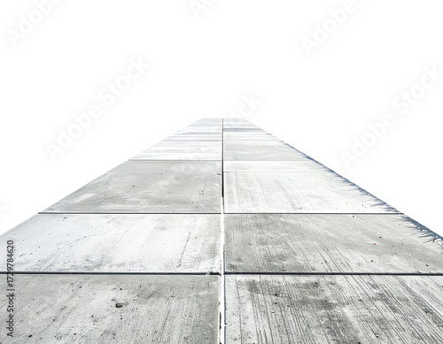 Perspective view of a light gray concrete pathway extending into the distance