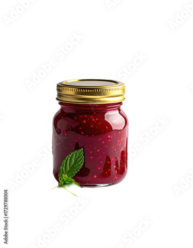 A glass jar of red berry jam.  Gold lid. Mint leaf