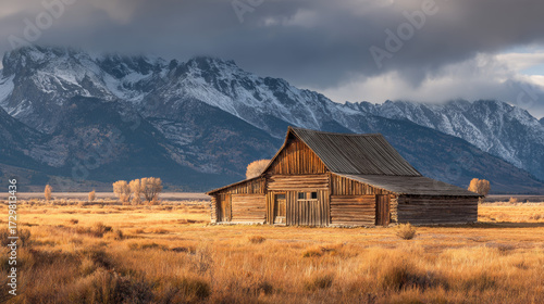 Captivating Rustic Barn Set Against Majestic Mountains in a Beautiful Autumn Landscape – A Perfect Blend of Nature and Architecture