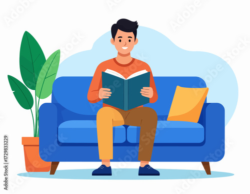 Smiling young man sitting on a sofa reading a book indoors, surrounded by plants and home decor in a cozy and modern living room setting.