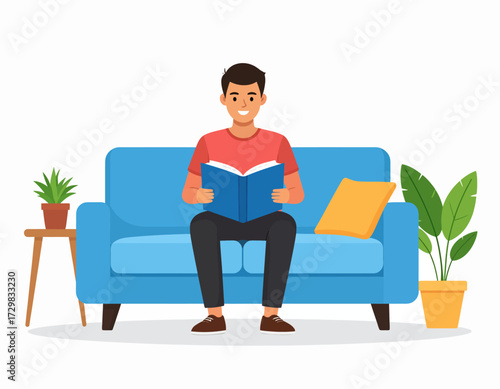 Young man sitting on a sofa reading a book at home, relaxed and smiling with indoor plants and cozy modern interior decor around him.