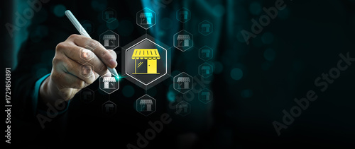 Fotografie Franchise business concept with businessman selecting store icon on virtual scre
