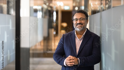 Quadro su tela Portrait of middle-aged Indian businessman, executive manager or company CEO
