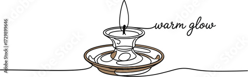 A vintage style candle in an ornate brass candlestick casts a warm inviting glow with the words warm glow written in elegant script next to the flame