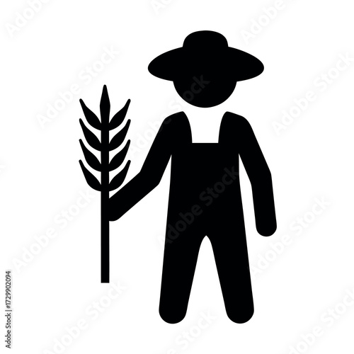Silhouette of a farmer wearing overalls and a hat holding a stalk of wheat