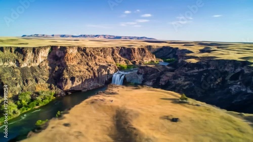 Scenic Waterfall Flowing Through Canyon Landscape
