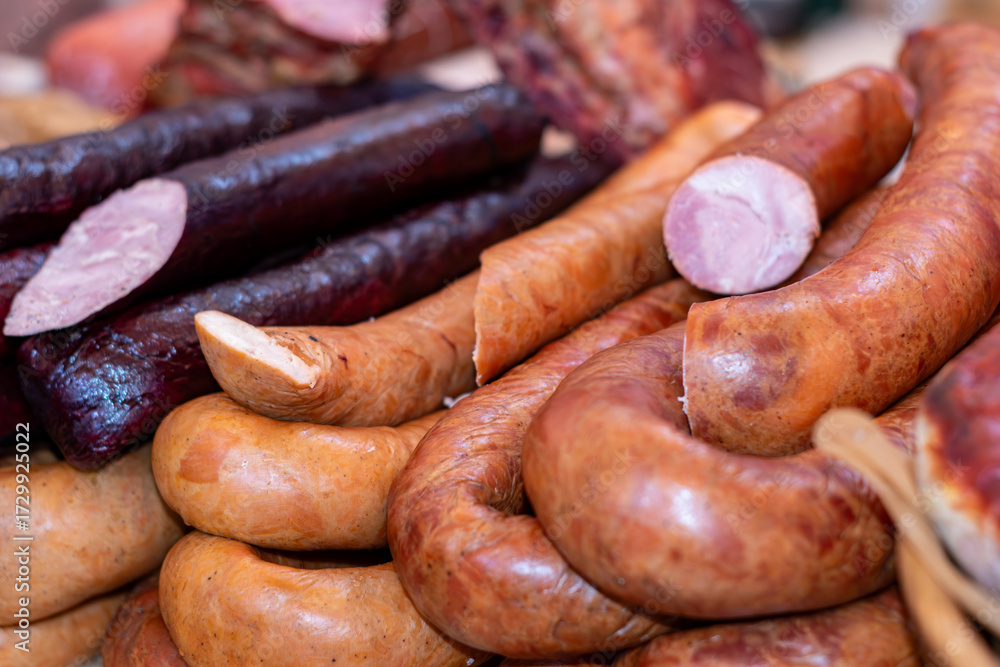 Fototapeta premium A variety of sausages at a street food market. Selective focus.