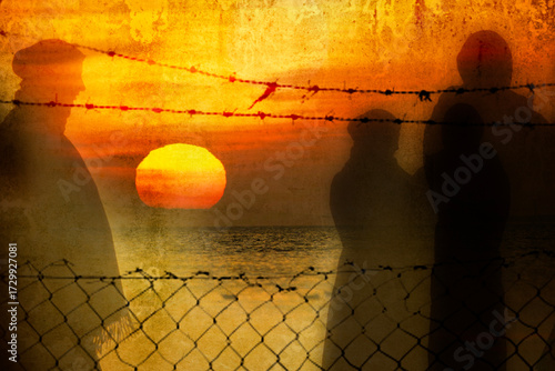 Refugee in Ukraine and Gaza and in the world showed as shadows on a wall with barbed wire