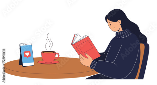 A young woman sitting at a table reading a book while a hot cup of coffee and a smartphone are beside her.
