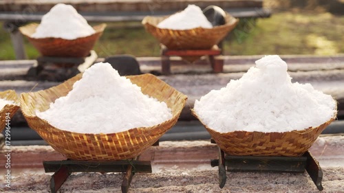 Dolly, traditional sea salt harvest in bali, natural salt in bamboo baskets, indonesia, handmade