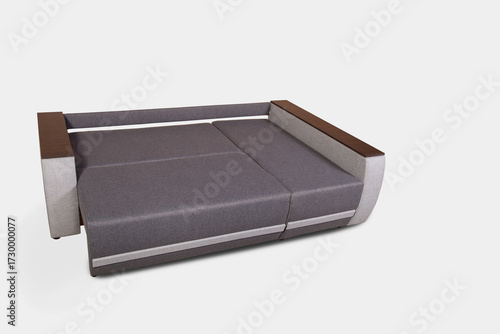 Isolated fold-out sofa with drawer for bedding on white background.