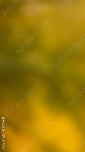 Dark, abstract background featuring dappled sunlight through yellow-green foliage. Perfect for deep nature themes and magical forest light.