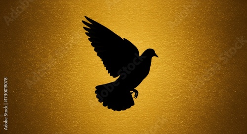 Silhouette of a soaring bird against a golden background symbolizing peace and freedom