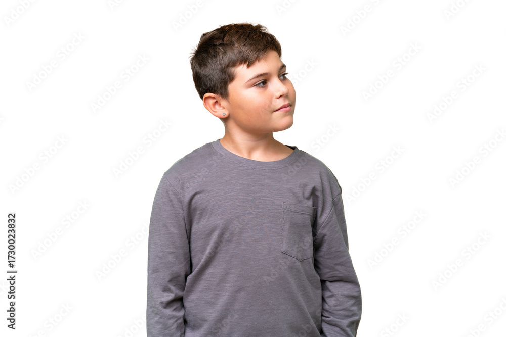 Fototapeta premium Little caucasian kid over isolated chroma key background looking to the side