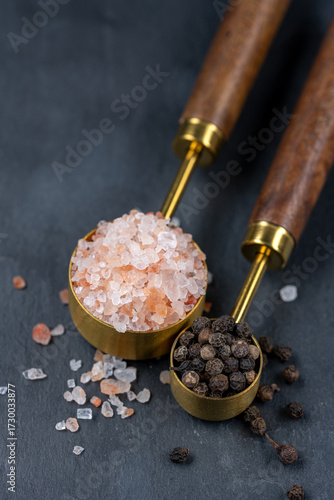 Elegant spice measuring spoons with salt and pepper