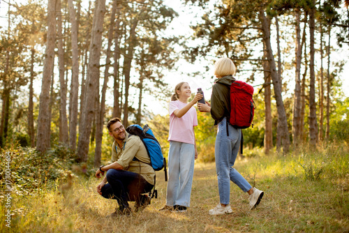Family enjoys hiking togeth...