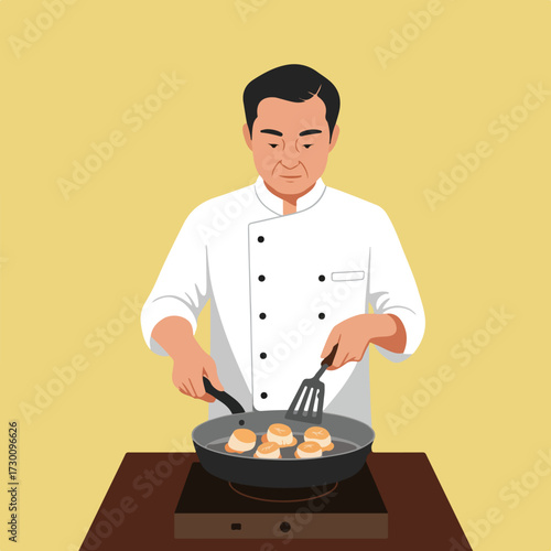 Chef in white cooking scallops in frying pan on stovetop
