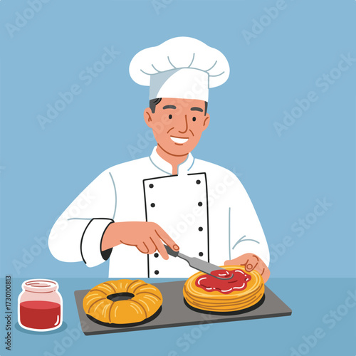 Chef spreading jam on cake