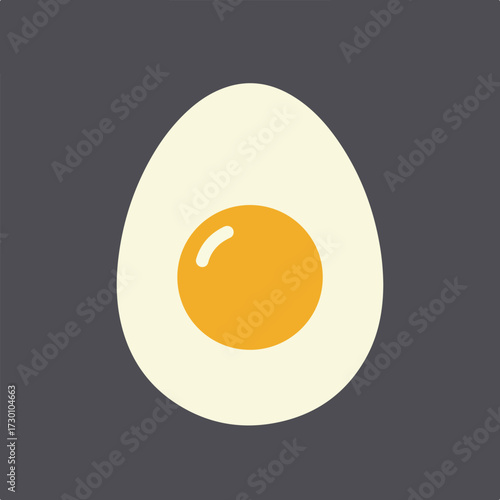 Cut boiled egg with yellow yolk on grey