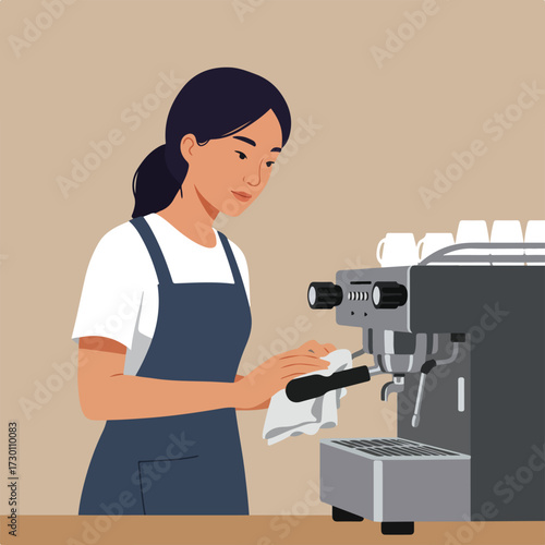 Barista wipes espresso machine