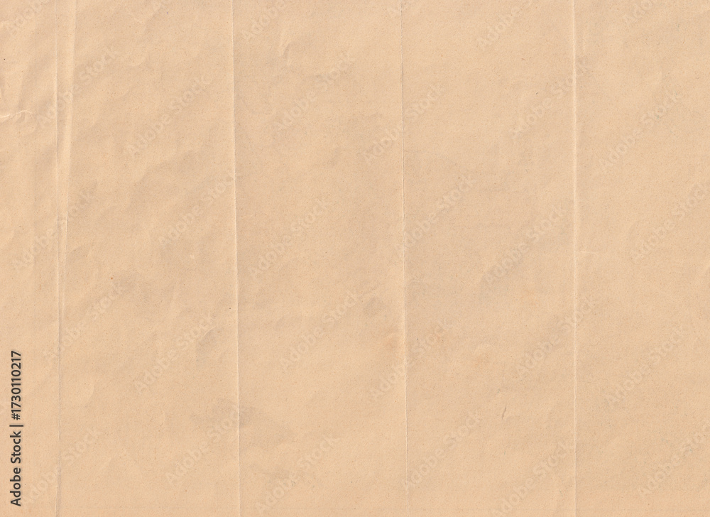 Fototapeta premium Beige folded paper texture background