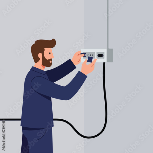 Man connecting modules into a wall-mounted device, cable running down