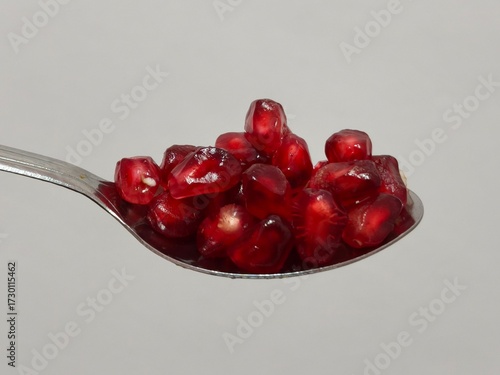 Photos Spoonful of Fresh Pomegranate Seeds