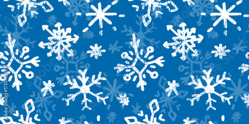 Seamless pattern with cute hand drawn snowflakes in doodle style. Blue winter wallpaper, charcoal texture, ornate child drawings. Decoration, background for Christmas, New Year designs, greeting card.
