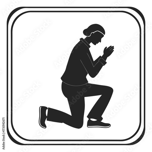 Silhouette of a woman kneeling in prayer