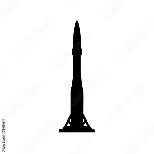 Silhouette of a rocket on its launch platform, poised for takeoff
