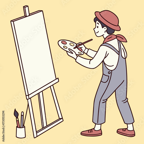 A cheerful young artist wearing overalls and a hat stands at an easel with a palette and brush ready to create a masterpiece on a blank canvas