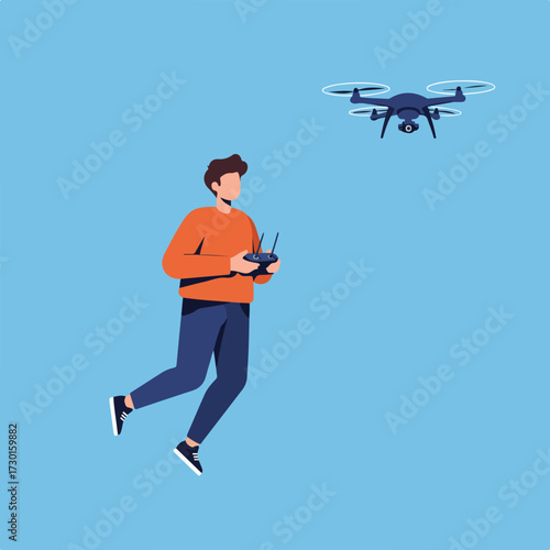 Person controls drone against blue backdrop, wearing orange shirt and blue pants