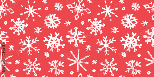 Seamless pattern with cute hand drawn snowflakes in doodle style. Red winter wallpaper, charcoal texture, ornate child drawings. Decoration, background for Christmas, New Year designs, greeting cards.