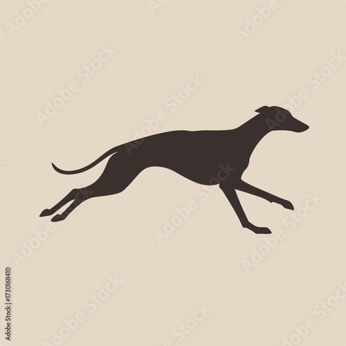 Dark silhouette of a running greyhound against a light brown background