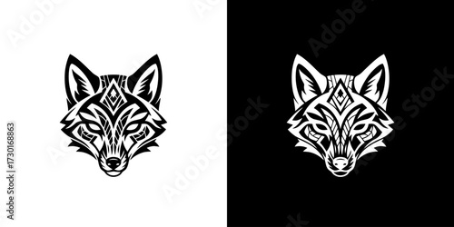A striking black and white illustration of a stylized wolf's head with intricate tribal markings.