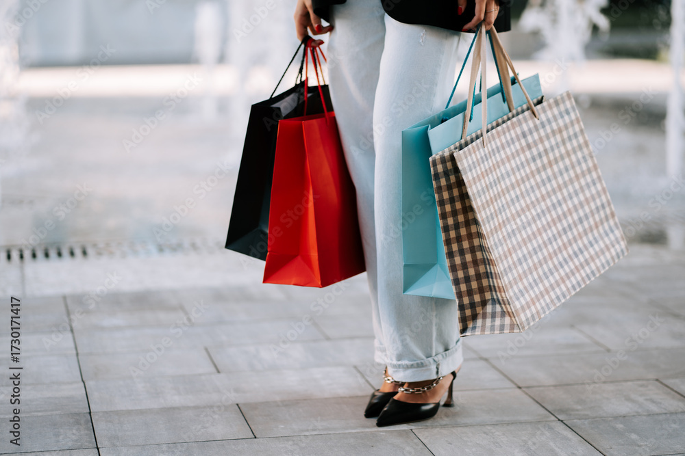 Φωτογραφία Woman enjoys a shopping spree with colorful bags in a lively outdoor setting