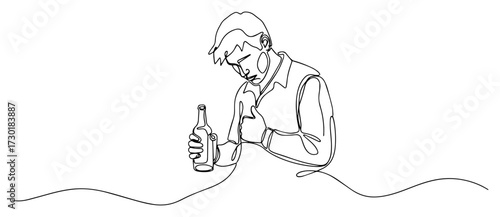 Depressed Man Drinking Alcohol Alone from a Bottle