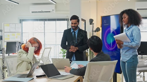 Multiethnic business professionals collaborate in modern office using AI virtual assistant and big data analytics to connect insights, driving strategic innovation through intelligent automation